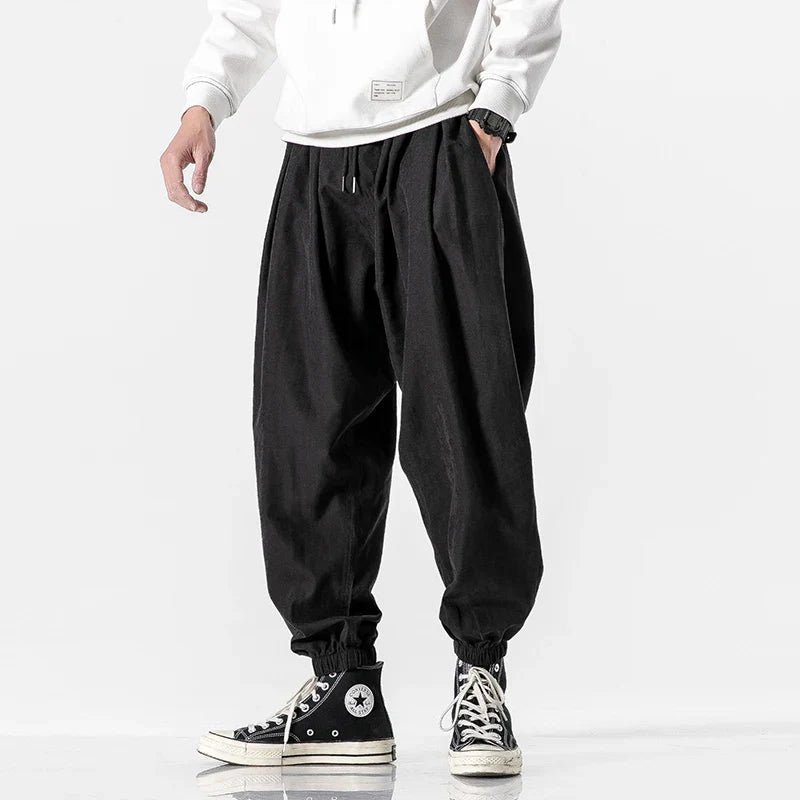 https://cdn.shopify.com/s/files/1/0548/7604/5509/files/2023-Men-Korean-Style-Casual-Pants-Mens-Fashion-Black-Pants-Hip-Hop-Streetwear-Plus-Size-5XL_jpg.webp?v=1704815111